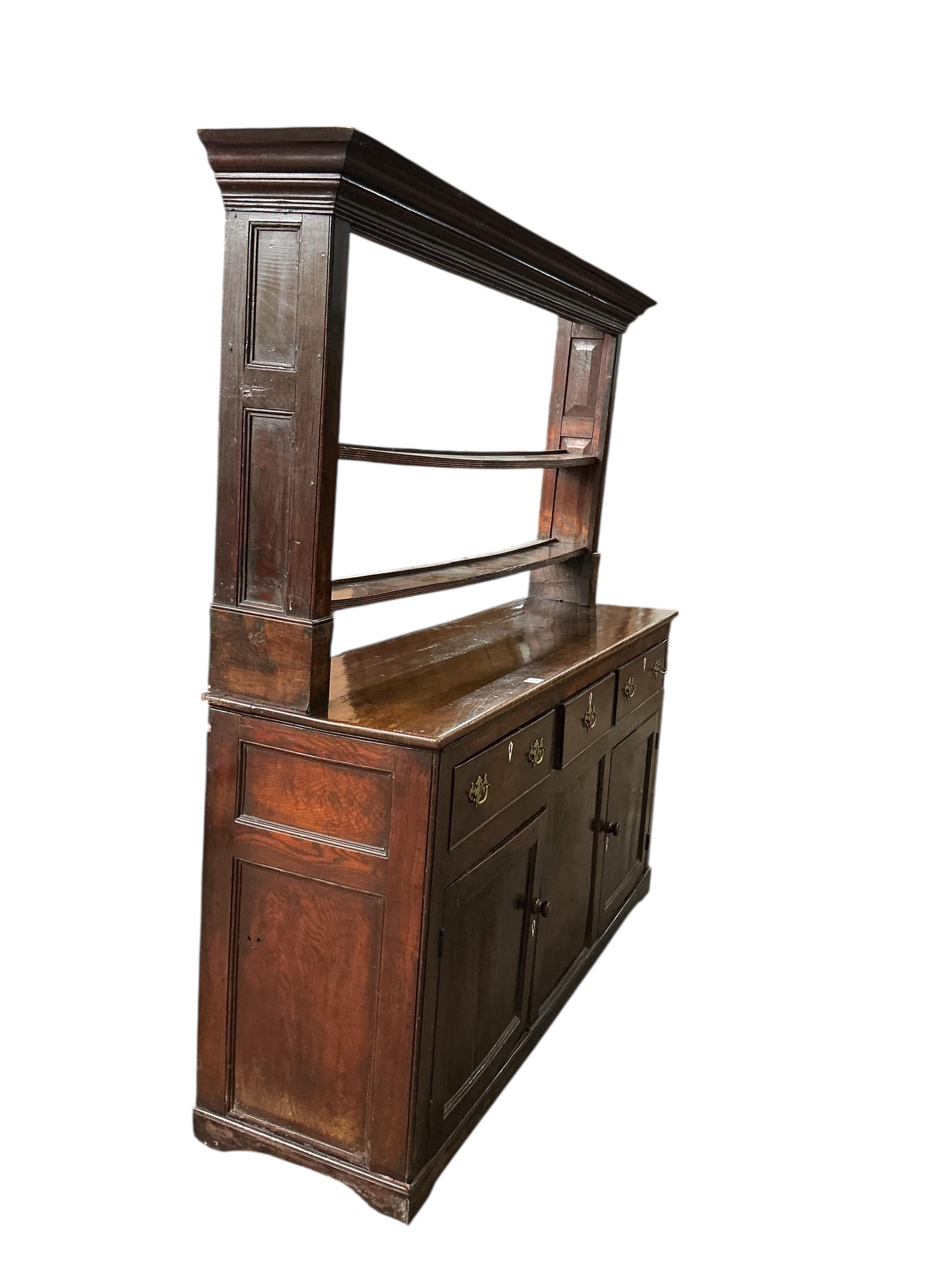 An 18th century oak dresser with open rack, (back boards wormed), width 170cm, depth 47cm, height 182cm